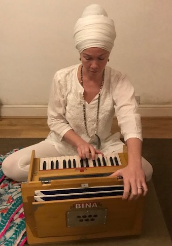 Gemma Bliss playing the harmonium